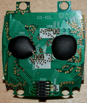 Circuit board with two epoxy blobs and many traces and vias